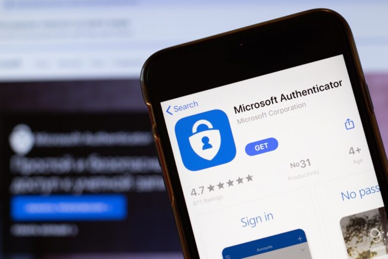 Microsoft Authenticator app logo on phone screen.
