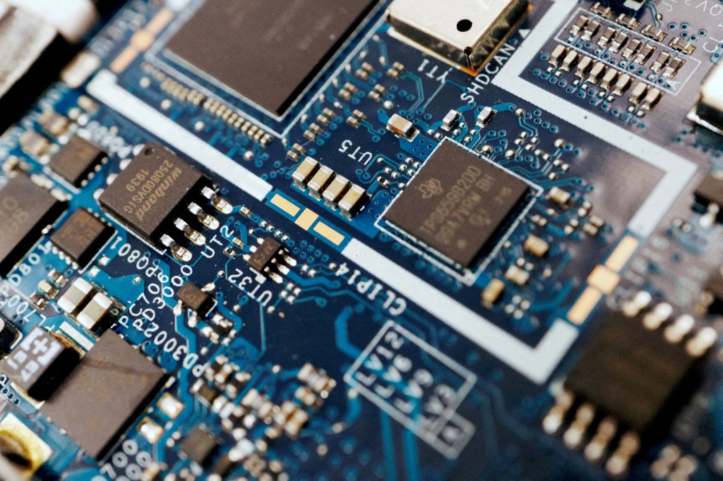 Semiconductor chips are seen on a circuit board