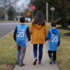 The author walking with her sons, then ages 11 and 8.