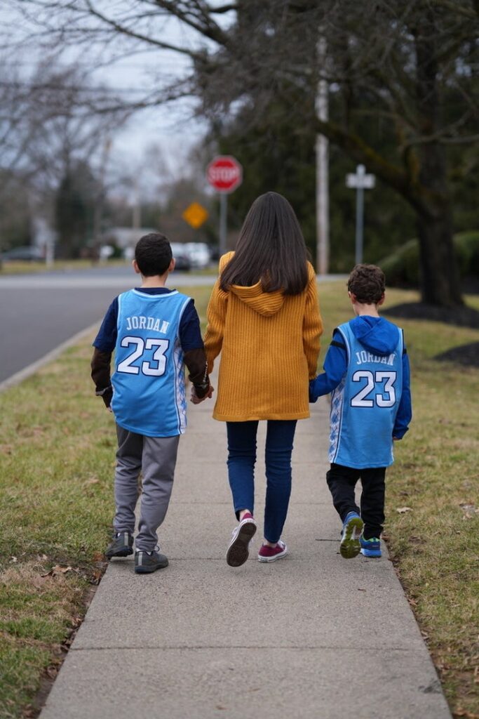 The author walking with her sons, then ages 11 and 8.