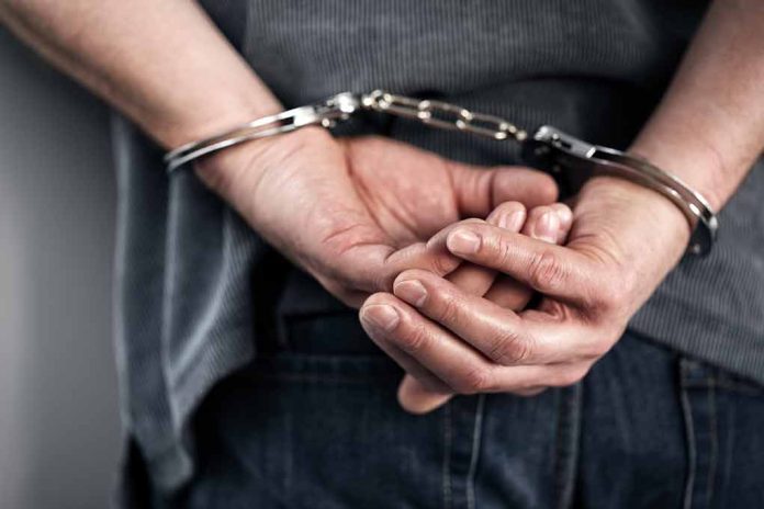 Person in handcuffs with hands behind back