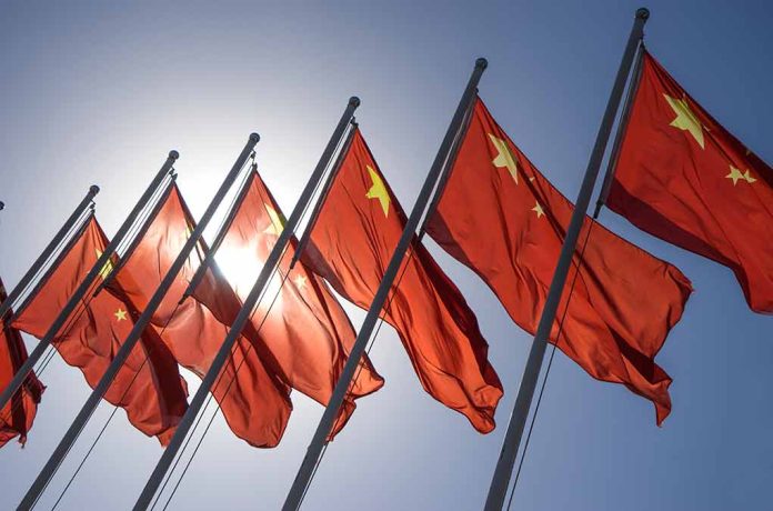 Red flags with yellow stars on flagpoles