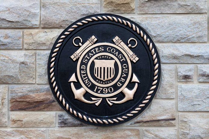 United States Coast Guard emblem on stone wall.