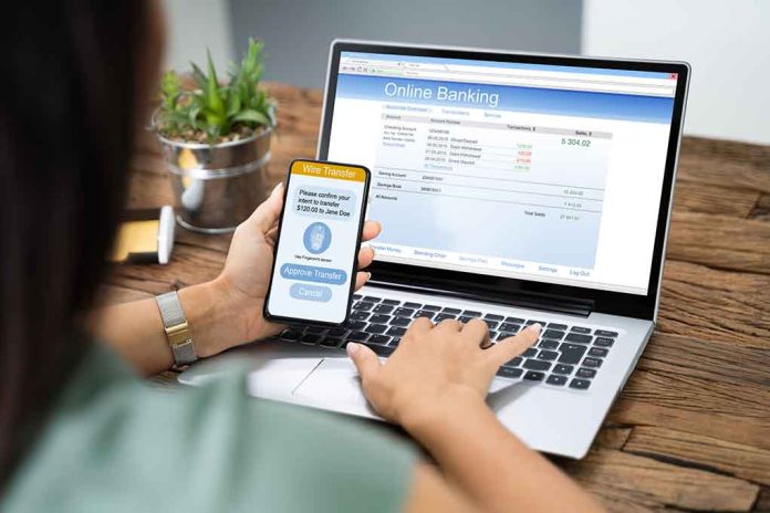 Person using phone and laptop for online banking