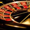 Closeup of roulette wheel with spinning ball