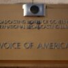 WASHINGTON, DC - MARCH 17: The Voice of America (VOA) sign is displayed on its building on March 17, 2025 in Washington, DC. President Donald Trump signed an executive order to eliminate the U.S. Agency for Global Media (USAGM), the parent agency of VOA, and put VOA employees on administrative leave. (Photo by Alex Wong/Getty Images)