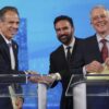 Democratic mayoral candidates Andrew Cuomo, left, shakes hands with Zohran Mamdani, center, as Whitney Tilson reacts after participating in a Democratic mayoral primary debate, Wednesday, June 4, 2025, in New York.