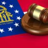 Georgia flag and judges gavel on wooden base