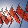 Red flags with yellow stars on flagpoles
