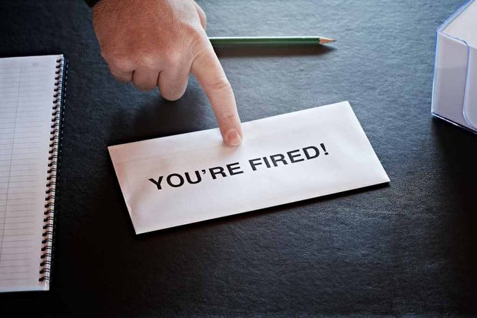 Envelope with YOURE FIRED and pointing finger
