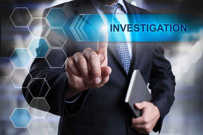 Man in suit pointing at Investigations text