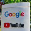 Google and YouTube sign with trees in background