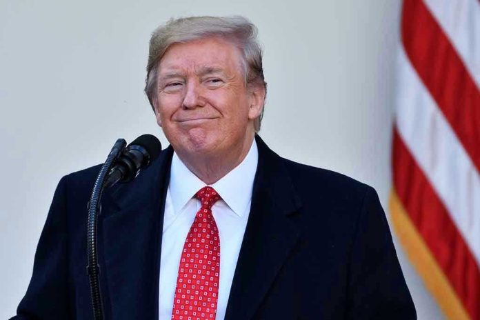 Man in suit and tie speaking at podium