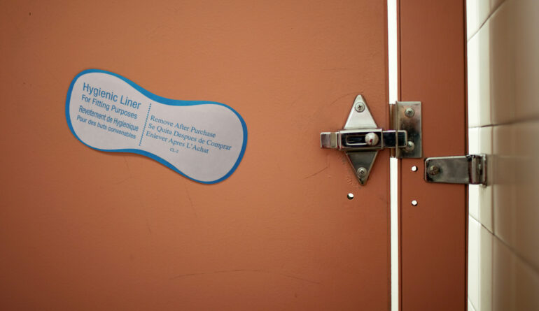 Satire news: swimsuit hygienic liner slapped onto beach bathroom stall