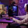 a gamer playing on a full gaming setup