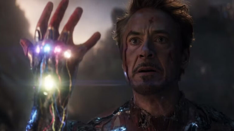 Tony Stark holding the Infinity Stones in his armored right hand in Avengers: Endgame