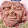An intricately carved medieval sandstone head discovered during archaeological excavations at Skaill Farm on the island of Rousay, Orkney