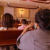 People sitting in church pews during service