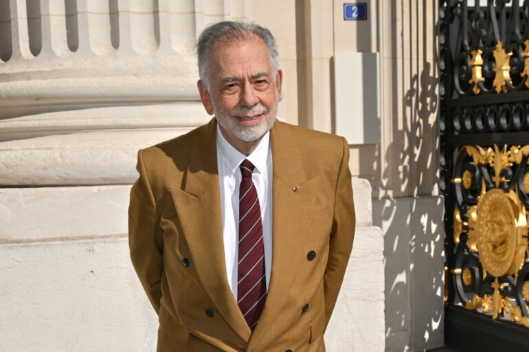 Francis Ford Coppola in the dark tan suit.