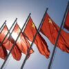 Red flags with yellow stars on flagpoles