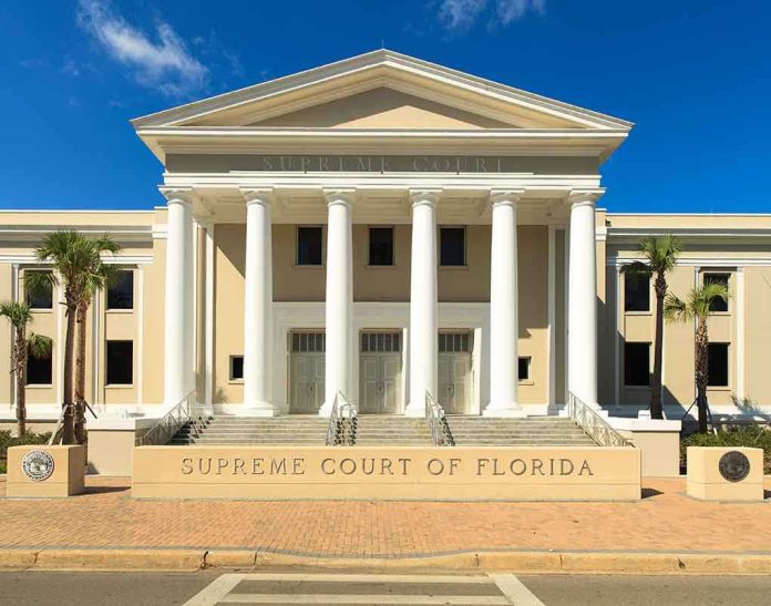 Exterior view of the Supreme Court of Florida with columns and palm trees
