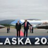 US President Donald Trump (R) and Russian President Vladimir Putin pose on a podium on the tarmac after they arrived at Joint Base Elmendorf-Richardson in Anchorage, Alaska, on August 15, 2025. Putin is in Alaska at the invitation of Trump in his first visit to a Western country since he ordered the 2022 invasion of Ukraine that has killed tens of thousands of people. (Photo by ANDREW CABALLERO-REYNOLDS / AFP) (Photo by ANDREW CABALLERO-REYNOLDS/AFP via Getty Images)