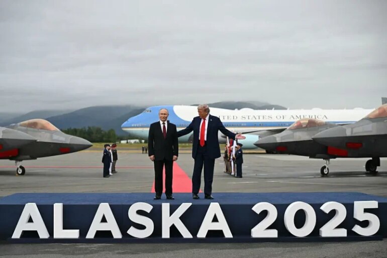 US President Donald Trump (R) and Russian President Vladimir Putin pose on a podium on the tarmac after they arrived at Joint Base Elmendorf-Richardson in Anchorage, Alaska, on August 15, 2025. Putin is in Alaska at the invitation of Trump in his first visit to a Western country since he ordered the 2022 invasion of Ukraine that has killed tens of thousands of people. (Photo by ANDREW CABALLERO-REYNOLDS / AFP) (Photo by ANDREW CABALLERO-REYNOLDS/AFP via Getty Images)