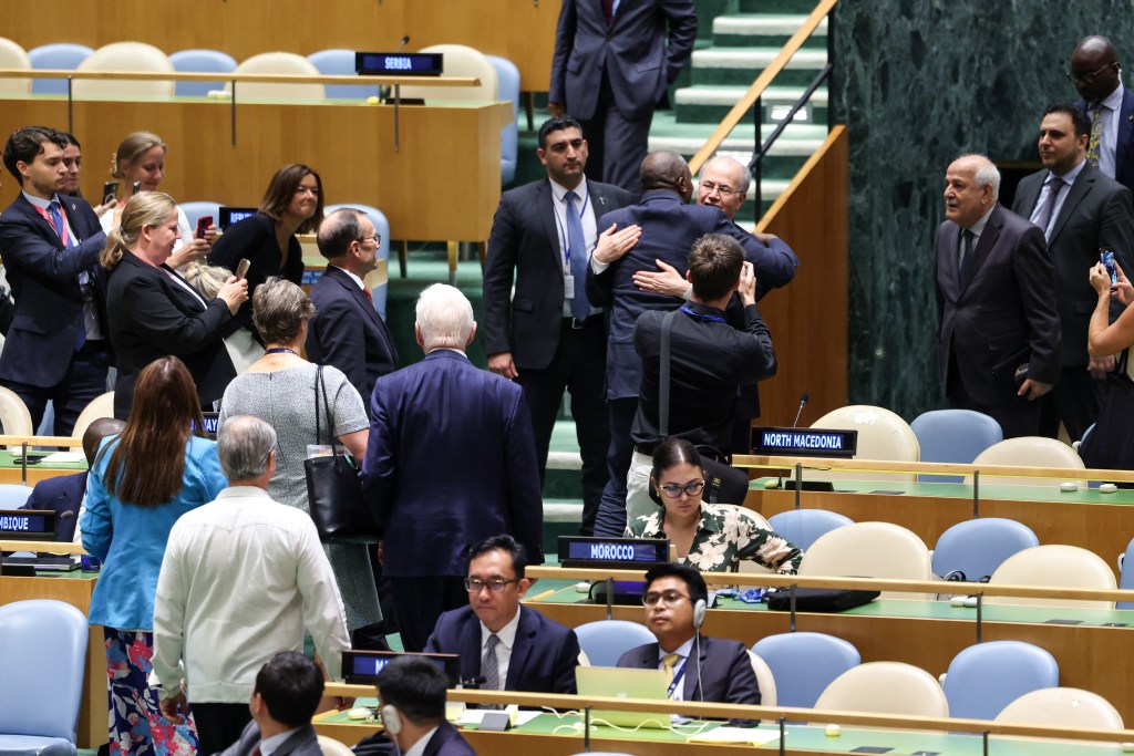 British Foreign Secretary David Lammy embracing Palestinian Prime Minister Mohammad Mustafa at a UN conference.