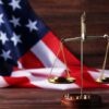 Scales of justice with American flag background