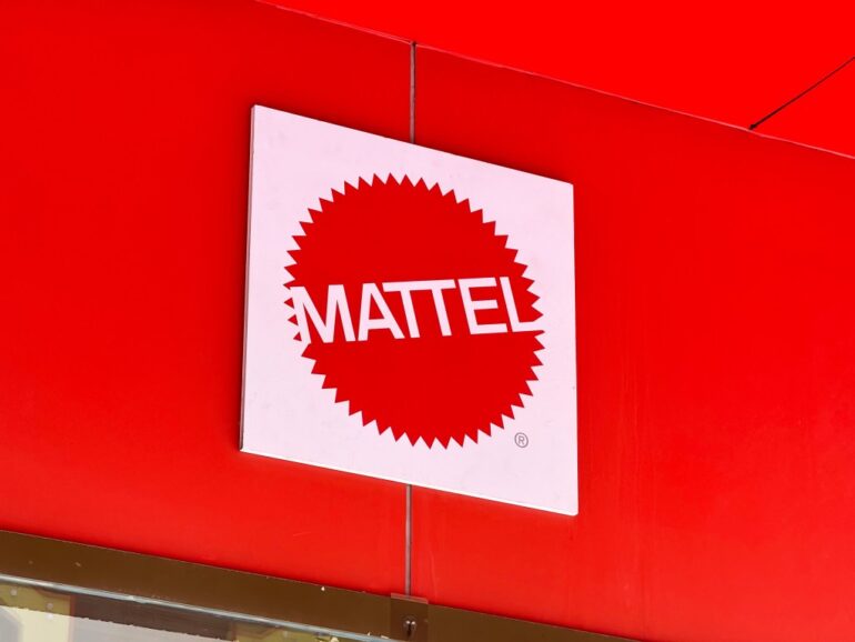 Mattel logo on a red wall.