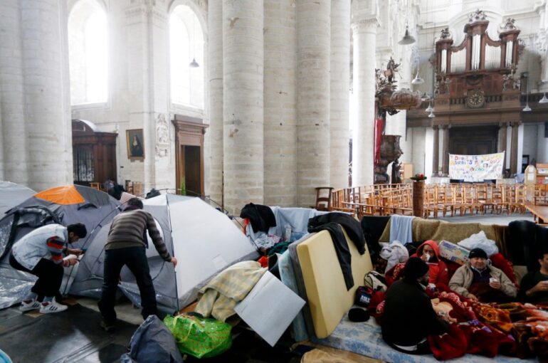 Afghan asylum seekers inside a Brussels church.