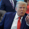 US President Donald Trump talks to journalists after signing executive orders in the Oval Office at the White House on August 25, 2025.