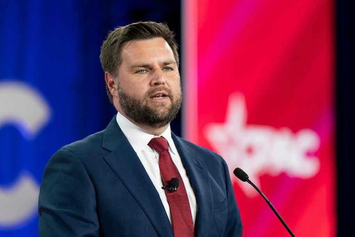 Man in a suit speaking at a podium.