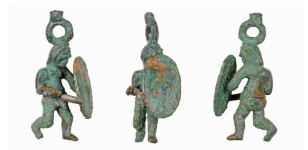 The Celtic warrior statuette after restoration, depicting a warrior in lunging pose with sword and shield
