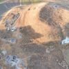 Aerial view of Uşaklı Höyük archaeological excavation showing large mound