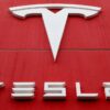 Tesla logo on a red building.