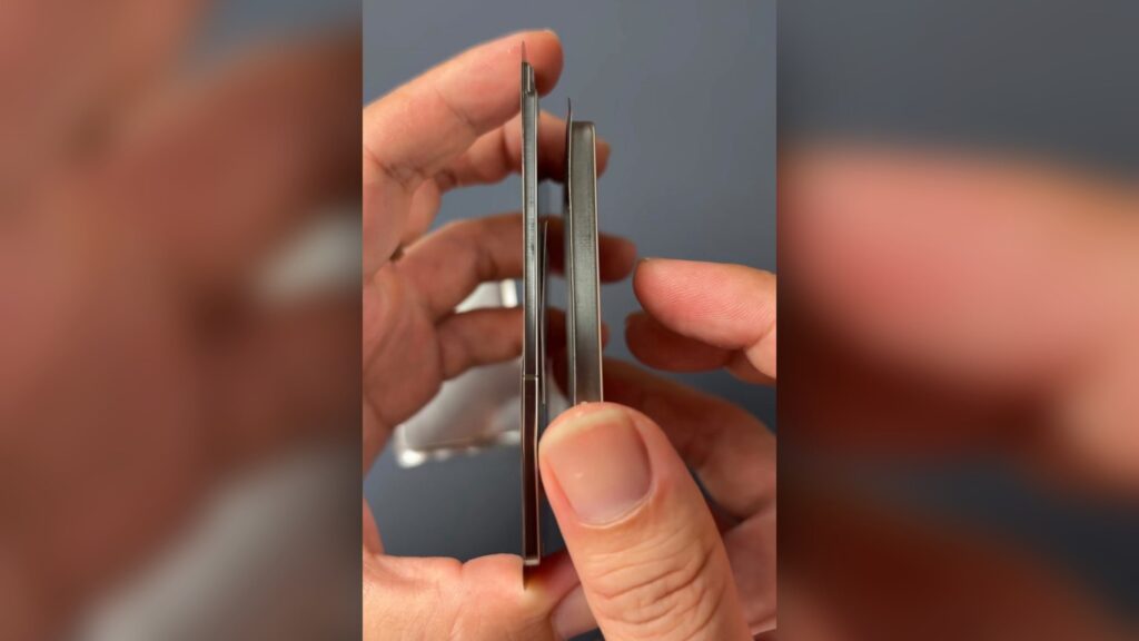 A person holds two batteries purporting to be from the iPhone 17 Air and the iPhone 17 Pro.
