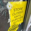 A bullet hole is visible in the door of a CVS pharmacy on Saturday, August 9, 2025, near where police say a man was shooting at the headquarters of the U.S. Centers for Disease Control and Prevention in Atlanta. (AP Photo/Jeff Amy)