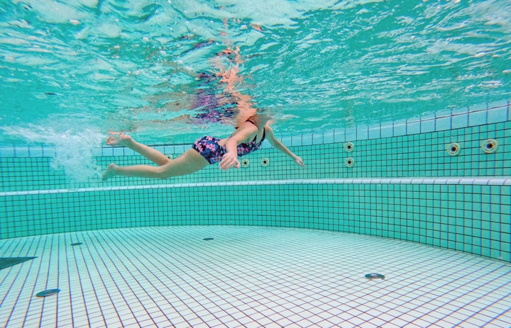 The more organic matter in the pool, the more chloramines are produced (that includes pee, along with sweat and poop particles).