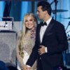 WASHINGTON, DC - JANUARY 19: Charlie Kirk (R) and and his wife Erika Lane Frantzve (L) on stage during the Turning Point USA Inaugural-Eve Ball at the Salamander Hotel on January 19, 2025 in Washington, DC. (Photo by Samuel Corum/Getty Images)
