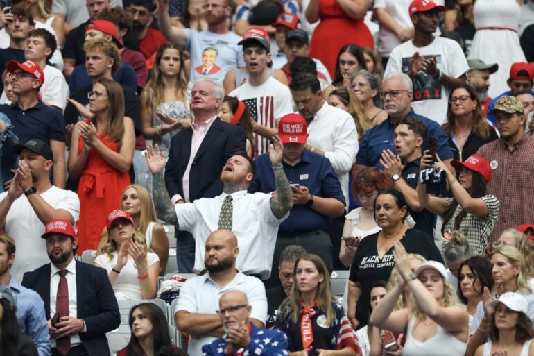 - SEPTEMBER 21: Attendees await the start of the memorial service for political activist Charlie Kirk at State Farm Stadium on September 21, 2025 in Glendale, Arizona.