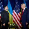 Ukrainian President Volodymyr Zelenskyy and former US President Donald Trump facing each other, flanked by Ukrainian and American flags.