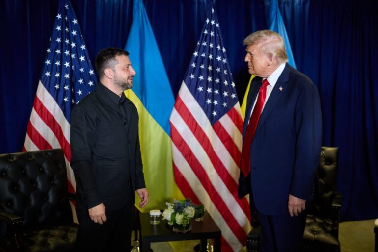 Ukrainian President Volodymyr Zelenskyy and former US President Donald Trump facing each other, flanked by Ukrainian and American flags.