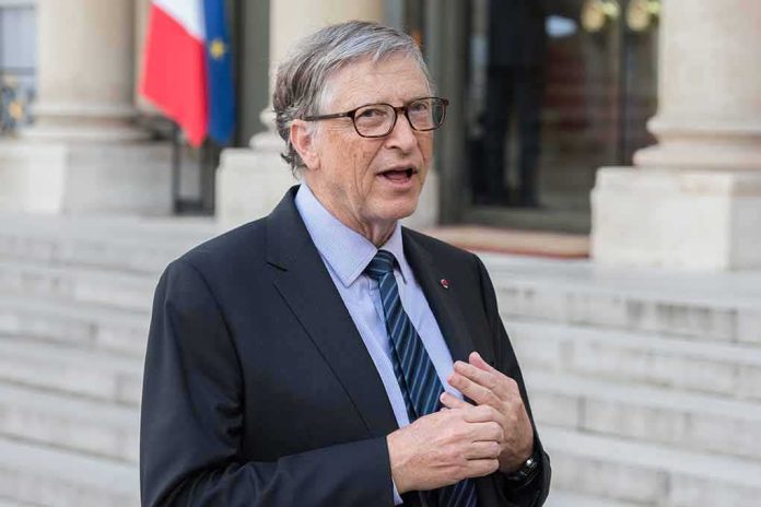 A man in a suit speaking outdoors near a building