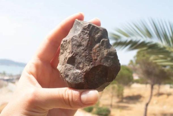 Paleolithic handaxe with broken distal end discovered during the Ayvalık survey.