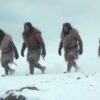 Early humans walking in Ice Age conditions in prehistoric Britain.