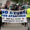 Demonstrators holding a banner that reads "NO AZURE FOR APARTHEID END ALL AZURE CONTRACTS WITH IOF" during a rally in Seattle.