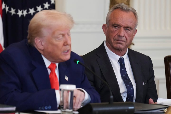 President Donald Trump (left) speaks as Health and Human Services Secretary Robert F. Kennedy Jr. listens during a Make America Healthy Again Commission Event in the East Room of the White House in May.