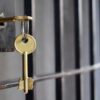 Key in lock of prison cell door.