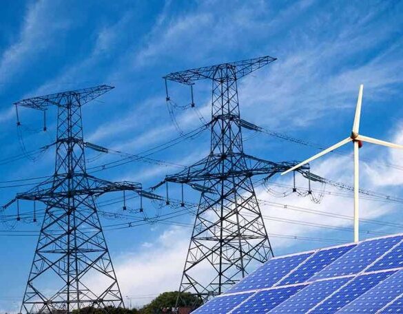 Solar panels and a wind turbine with power lines against a blue sky